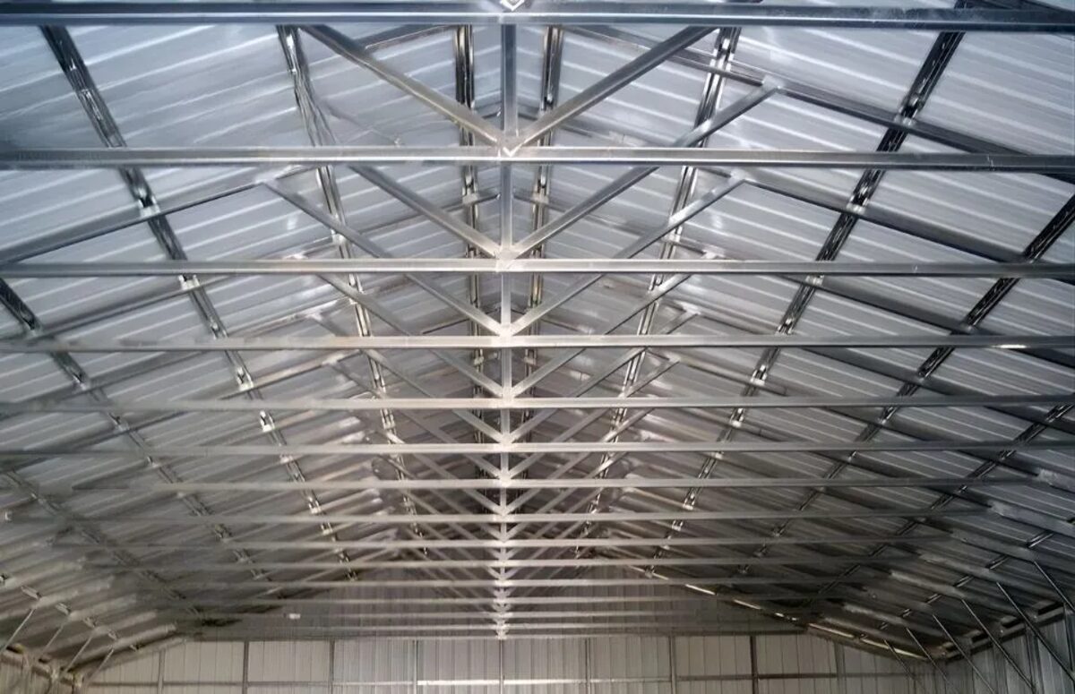 Interior of clear-span RV storage building showing square tube steel trusses